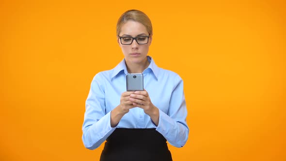 Irritated Office Worker Browsing Internet Site on Smartphone, Mobile Tariff