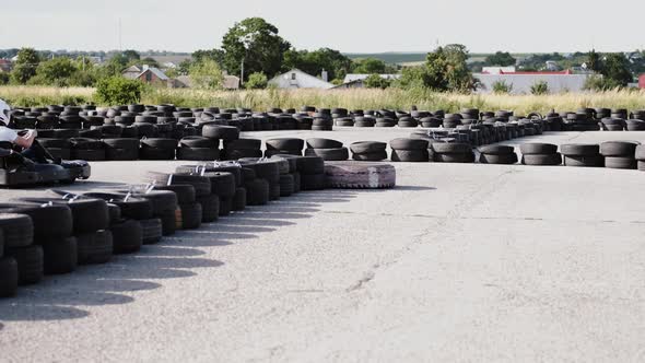 Male Racer in Protective Helmet Racing on the Go-kart Track Outdoors