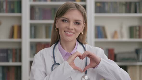 Portrait of Lady Doctor Showing Heart Shape By Hands