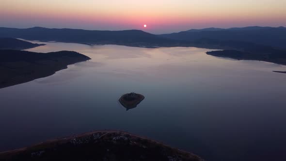 Aerial Panoramic View of Island on a Batak Reservoir in Sunrise Rhodopa Mountains Bulgaria