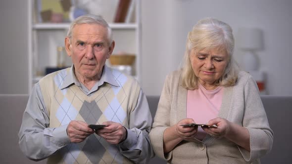 Sad Old Couple Counting Pension Benefit, Social Insecurity, Lack of Money