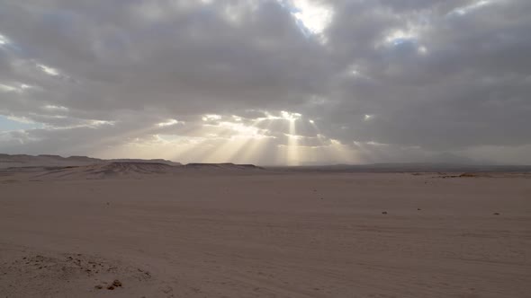Sun shining through clouds in the desert, Egypt.