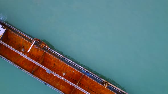 Overhead drone clip of a huge cargo ship in the strait of Melaka
