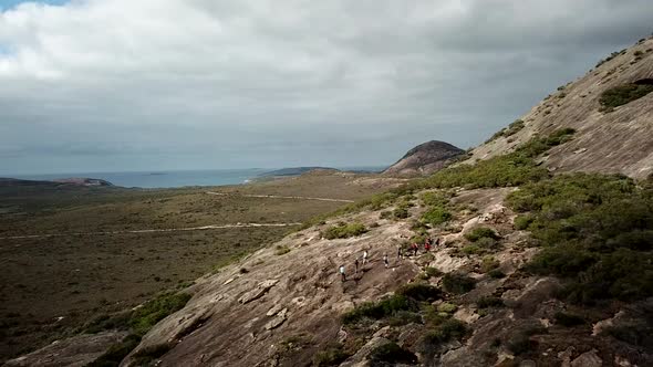 Group of travelers hiking in mountains