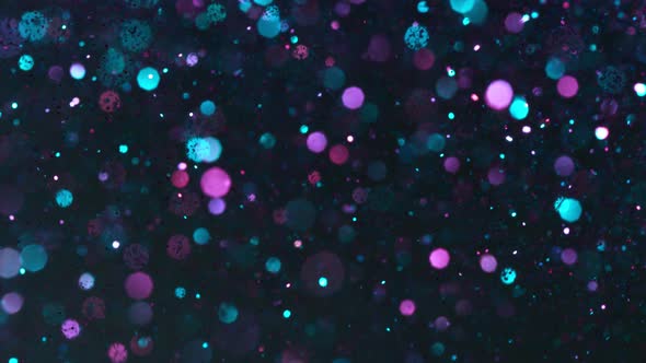 Super Slow Motion Shot of Neon Glitter Background at 1000Fps