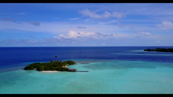 Aerial flying over abstract of idyllic island beach vacation by turquoise water with white sandy bac