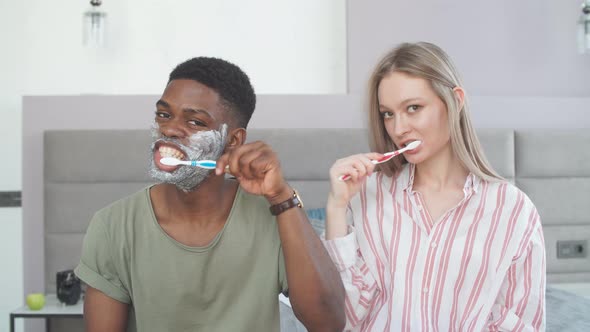 Couple Washing Teeth in Morning, Dental Hygiene Is Important