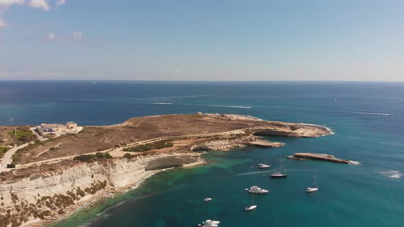 Aerial drone video from eastern Malta, Marsaxlokk area, Il-Hofra l-Kbira bay.