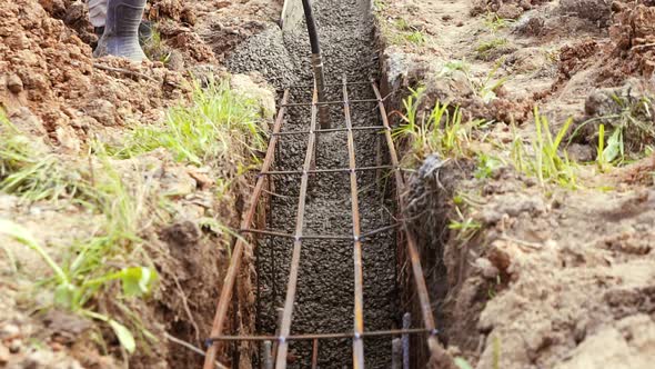 Workers Poured Cement Into the Foundation of the House