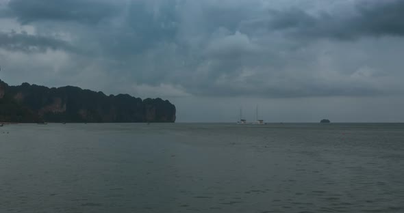 Time Lapse of Rain Clouds Over Beach and Sea Landscape with Boats. Tropical Storm in Ocean