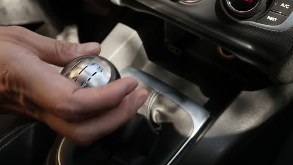 Shifting gears in car with hand slow-mo footage