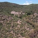 Drone view of Old Monastery surrounded by mountains and native Mediterranean vegetation - VideoHive Item for Sale