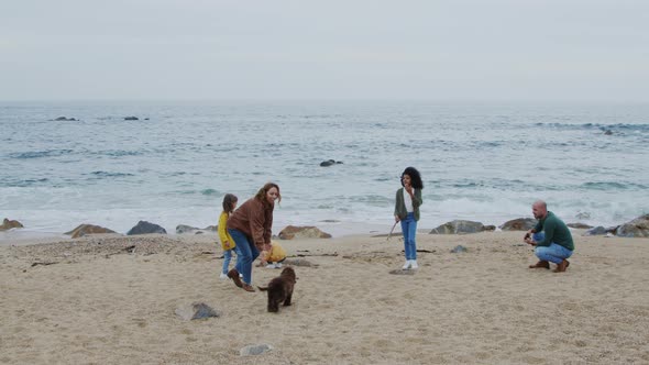 Family Is Spending Weekend On Beach