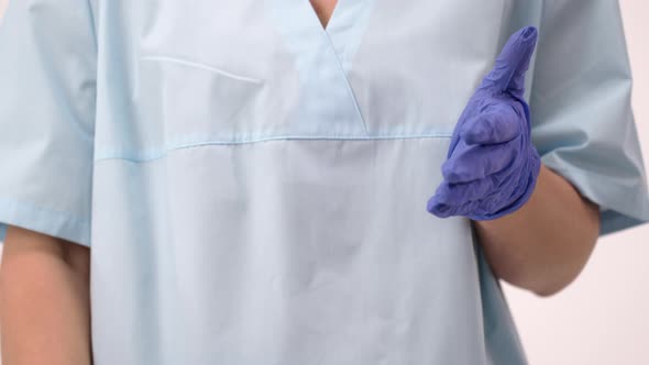 Doctor in Medical Uniform Uses Antibacterial Sanitizer Spray Against Coronavirus