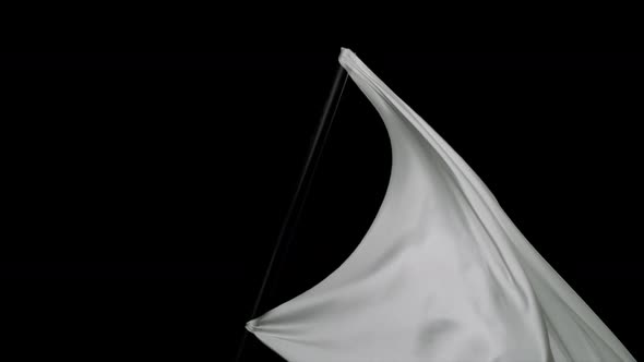 White fabric flowing on black background, Slow Motion