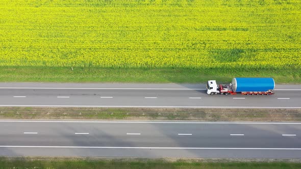 Transport Truck Carries A Large Cargo On The Highway