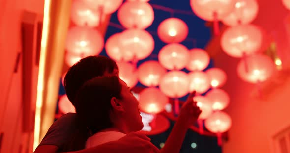 Chinese Couple Look at The Red Lantern Together