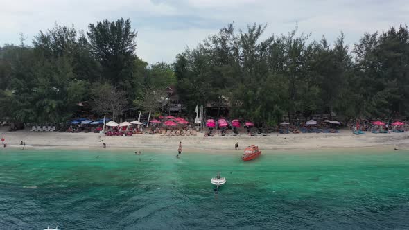 aerial dolly zoom out of beautiful tropical turquoise blue water in the Gili Islands around Bali Ind