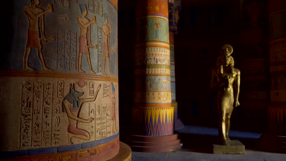 Interior of an Egyptian Temple. Colorful Columns Covered with Ancient Egyptian Characters and