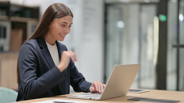 Businesswoman Doing Video Chat on Laptop