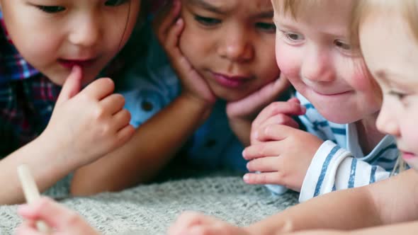 Interracial Kids Watching Video on Smartphone