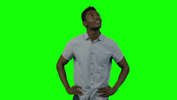 Man looking around against green screen