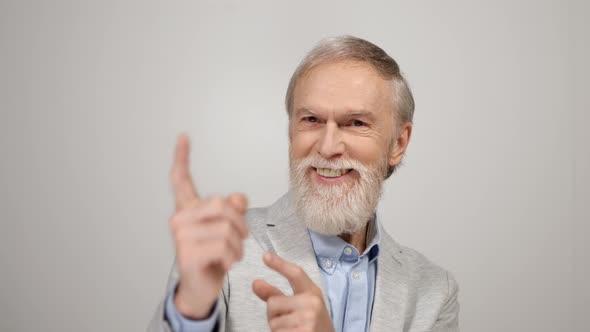 Old Man Pointing to Camera Inside