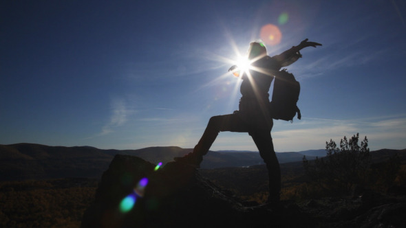 Woman Overcomes Difficult Mountain Peaks alt