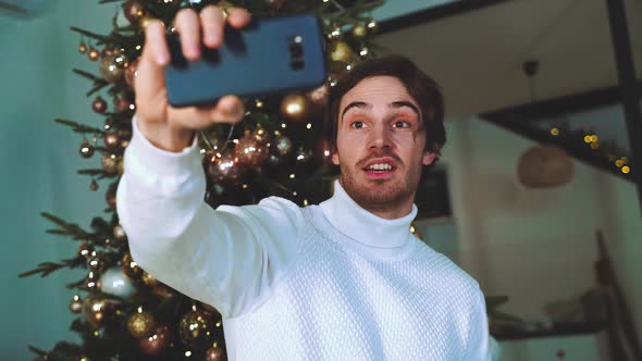 Happy couple celebrating christmas at home.