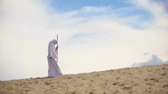 Arab With Staff Walking in Desert, Going to Goal Despite Heat and Exhaustion