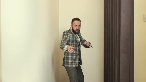 Stylish Young Man In Clothing Store Posing In New Suit.