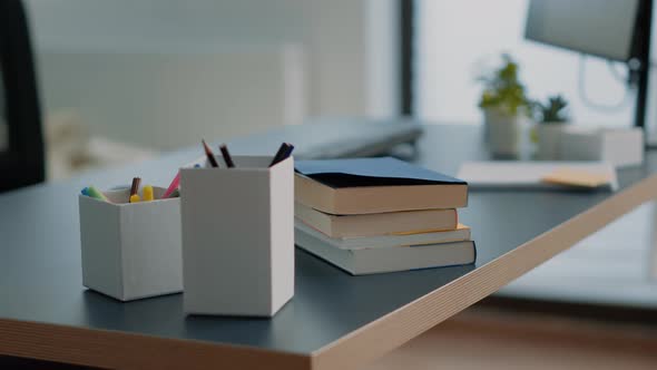 Close Up of Books and Computer with Keyboard on Desk