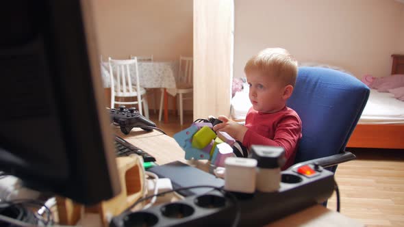 Little Boy Playing Computer Game With Joystick