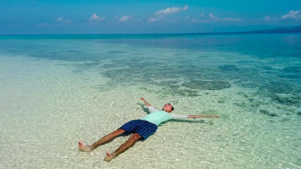 A Man on a Tropical Beach. Mahaba Island, Philippines.