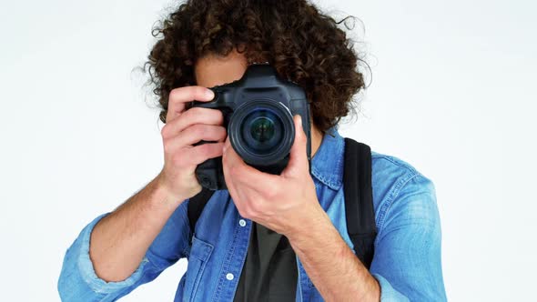 Photographer taking photo with professional digital camera