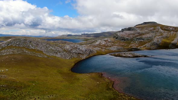 Turquoise Water Of Lagunas De Alto Peru Amidst The Rugged Terrain In Sao Paulo, Peru. aerial, pullba