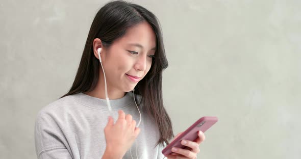 Woman talking on hand free with mobile phone 