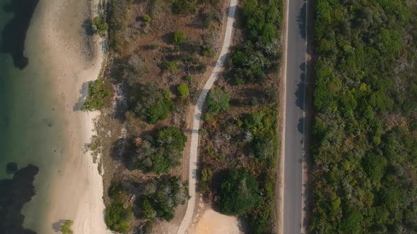 Aerial view of an outback road and walking path running through Australian native bush land situated