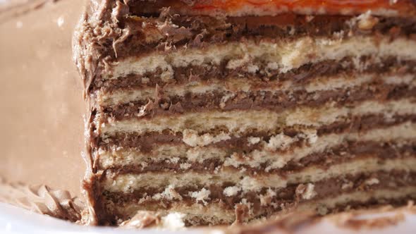 Multilayered torte with biscuits 4K 2160p 30fps UltraHD tilting footage - Close-up layers of chocola