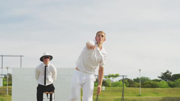 Cricket player throwing a ball as far as possible