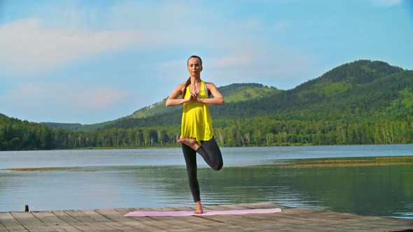 Tree Pose by a Lake 