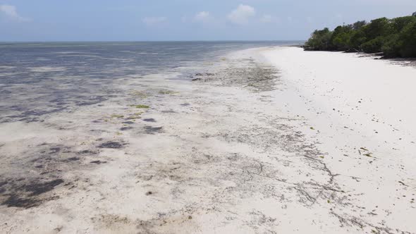 Aerial View of Low Tide in the Ocean Near the Coast of Zanzibar Tanzania Slow Motion