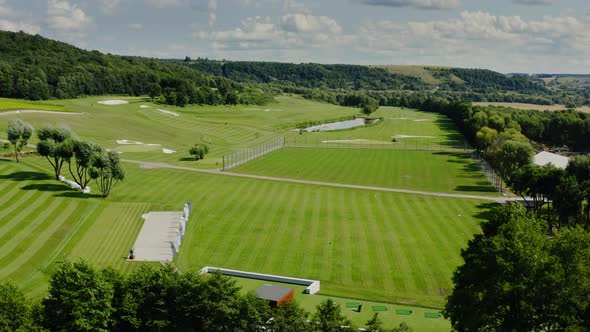 Aerial Drone Footage of Flying Over Golf Club in Summertime Sunlight