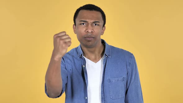 Fighting Angry Young African Man Yellow Background