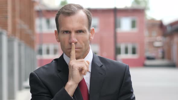 Silent, Silence Gesture by Businessman