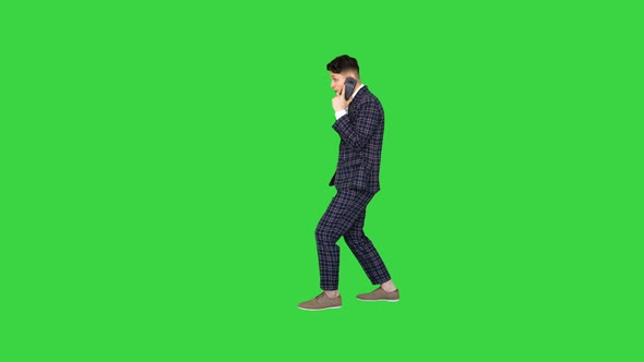 Inspired Man in Formal Receiving Good News on the Phone and Dancing After on a Green Screen, Chroma