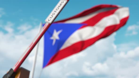 Closing Barrier with CUSTOMS Sign at Flag of Puerto Rico
