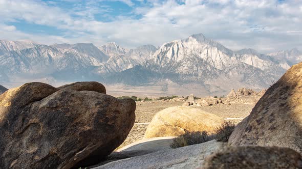 Slider timelapse of Mount Whitney in the Alabama hills with rocks in the foreground.