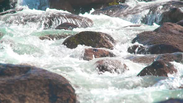 Sparkling Stream Flows on Rocks