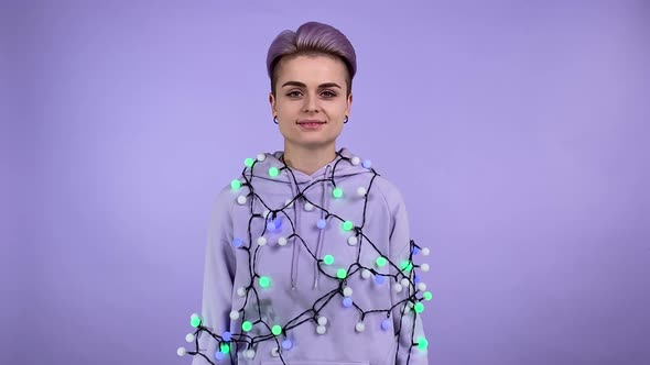 Positive Lgbt Person Hung with Lights Sharing Exhilaration Indoors